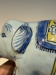 A pair of blue, white and yellow Frankfurt faience models of elephants, ca. 1700