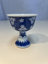 A Chinese blue and white 'Prunus on Cracked Ice' stem bowl, Kangxi