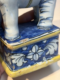 A pair of blue, white and yellow Frankfurt faience models of elephants, ca. 1700