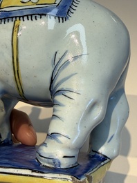 A pair of blue, white and yellow Frankfurt faience models of elephants, ca. 1700