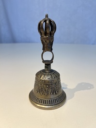 Three Tibetan bronze ritual bells and a bronze Buddha, 19th C.