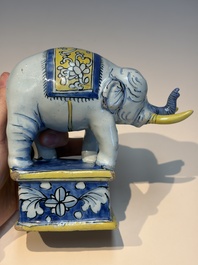 A pair of blue, white and yellow Frankfurt faience models of elephants, ca. 1700