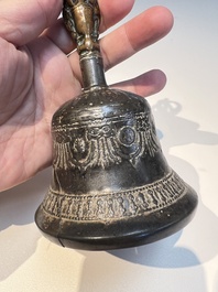 Three Tibetan bronze ritual bells and a bronze Buddha, 19th C.