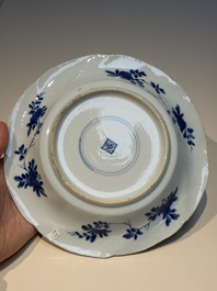 Four Chinese blue and white moulded plates with floral design, Kangxi