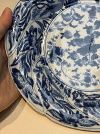 Four Chinese blue and white moulded plates with floral design, Kangxi