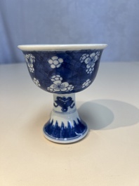 A Chinese blue and white 'Prunus on Cracked Ice' stem bowl, Kangxi