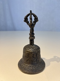 Three Tibetan bronze ritual bells and a bronze Buddha, 19th C.