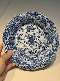 Four Chinese blue and white moulded plates with floral design, Kangxi