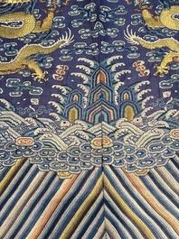 A Chinese blue-ground embroidered silk summer gauze 'Dragon' robe, 'Ji Fu' 吉服, 19th C.