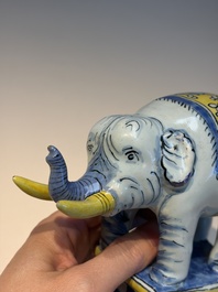 A pair of blue, white and yellow Frankfurt faience models of elephants, ca. 1700
