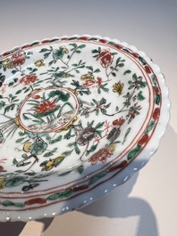 Three sets of Chinese famille verte cups and saucers with birds and flowers, various marks, Kangxi