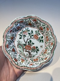 Three sets of Chinese famille verte cups and saucers with birds and flowers, various marks, Kangxi