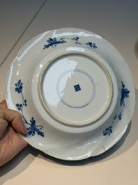 Four Chinese blue and white moulded plates with floral design, Kangxi