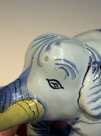 A pair of blue, white and yellow Frankfurt faience models of elephants, ca. 1700