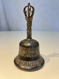 Three Tibetan bronze ritual bells and a bronze Buddha, 19th C.