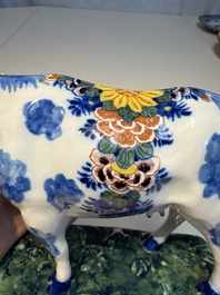A pair of polychrome Dutch Delft cows, 18th C.