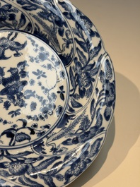 Four Chinese blue and white moulded plates with floral design, Kangxi