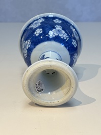 A Chinese blue and white 'Prunus on Cracked Ice' stem bowl, Kangxi