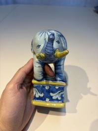 A pair of blue, white and yellow Frankfurt faience models of elephants, ca. 1700