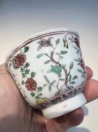 Three sets of Chinese famille verte cups and saucers with birds and flowers, various marks, Kangxi