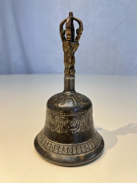 Three Tibetan bronze ritual bells and a bronze Buddha, 19th C.