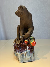 A Chinese polychrome-glazed Shiwan stoneware 'Monkey and Peach' group, signed, 20th C.