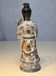 A Chinese famille rose candle holder in the shape of a court lady holding a 'Gu' vase, Qianlong