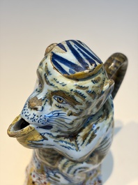 A pair of polychrome Dutch Delft monkey ewers and covers, 18th C.