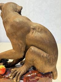 A Chinese polychrome-glazed Shiwan stoneware 'Monkey and Peach' group, signed, 20th C.