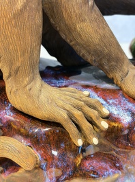 A Chinese polychrome-glazed Shiwan stoneware 'Monkey and Peach' group, signed, 20th C.