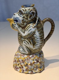 A pair of polychrome Dutch Delft monkey ewers and covers, 18th C.