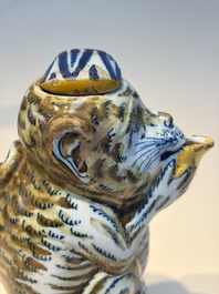A pair of polychrome Dutch Delft monkey ewers and covers, 18th C.