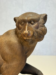 A Chinese polychrome-glazed Shiwan stoneware 'Monkey and Peach' group, signed, 20th C.