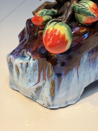 A Chinese polychrome-glazed Shiwan stoneware 'Monkey and Peach' group, signed, 20th C.