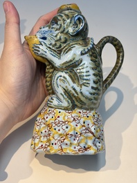A pair of polychrome Dutch Delft monkey ewers and covers, 18th C.