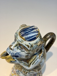 A pair of polychrome Dutch Delft monkey ewers and covers, 18th C.