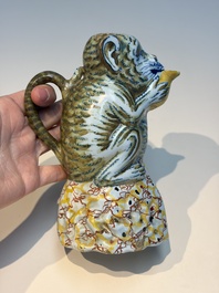 A pair of polychrome Dutch Delft monkey ewers and covers, 18th C.