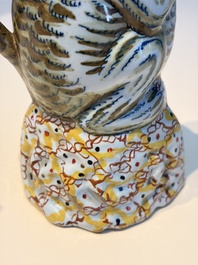 A pair of polychrome Dutch Delft monkey ewers and covers, 18th C.