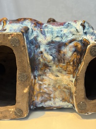 A Chinese polychrome-glazed Shiwan stoneware 'Monkey and Peach' group, signed, 20th C.