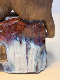 A Chinese polychrome-glazed Shiwan stoneware 'Monkey and Peach' group, signed, 20th C.