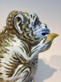 A pair of polychrome Dutch Delft monkey ewers and covers, 18th C.