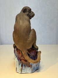 A Chinese polychrome-glazed Shiwan stoneware 'Monkey and Peach' group, signed, 20th C.