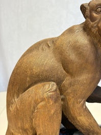 A Chinese polychrome-glazed Shiwan stoneware 'Monkey and Peach' group, signed, 20th C.