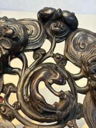 Two large Chinese carved wooden stands, 19th C.