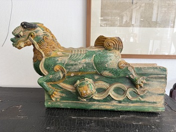 A large Chinese sancai-glazed pottery 'Buddhist Lion' roof tile, Ming
