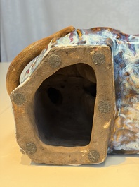 A Chinese polychrome-glazed Shiwan stoneware 'Monkey and Peach' group, signed, 20th C.