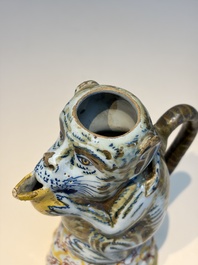 A pair of polychrome Dutch Delft monkey ewers and covers, 18th C.