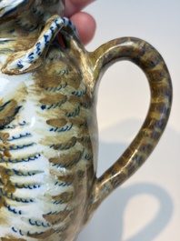 A pair of polychrome Dutch Delft monkey ewers and covers, 18th C.