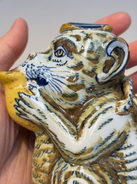 A pair of polychrome Dutch Delft monkey ewers and covers, 18th C.
