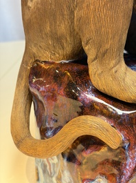 A Chinese polychrome-glazed Shiwan stoneware 'Monkey and Peach' group, signed, 20th C.